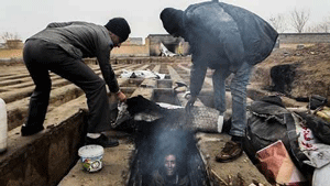 Destitute homeless Iranians live in cemeteries inside empty graves
