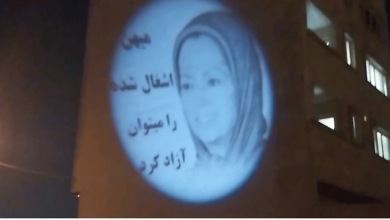 Iran-Shiraz: Projection of Image of Maryam Rajavi and the Slogan “The Occupied Homeland Can Be Freed.”